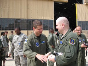 Col. Meeks, squadron commander, congratulating Bill. 